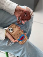 کاور سیلیکونی مدل خرسی بیبی لباس آبی و دونات قهوه ای رنگ مناسب برای گوشی آیفون